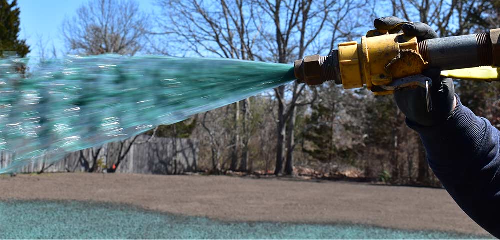 Hydroseed nozzle spreading seed